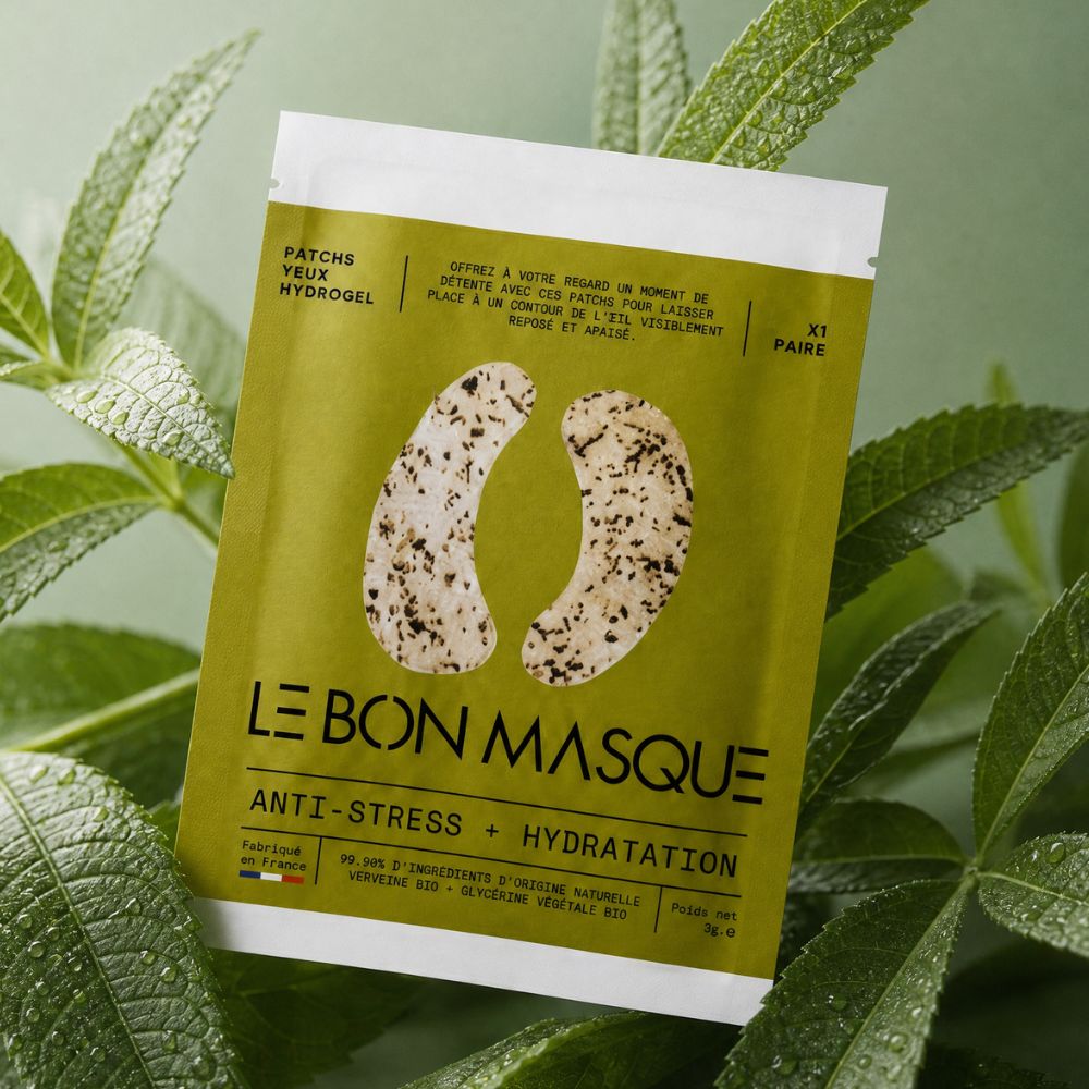 Patchs Yeux Verveine Bio Regard Reposé Le Bon Masque, sachet vert sur feuillage Image